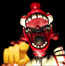 a cartoon character with a yellow fist pointing to the camera