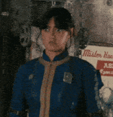a woman stands in front of a sign that says mister hand