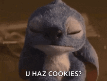 a stuffed animal with its eyes closed is saying `` u haz cookies ? ''