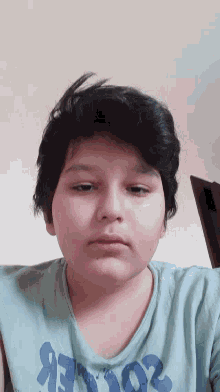 a boy wearing a t-shirt that says rockers on it