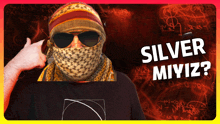 a man wearing sunglasses and a scarf with the words silver miyiz on the bottom right