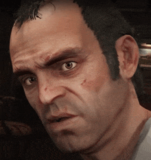 a close up of a man 's face with a very angry look on his face