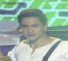 a man wearing suspenders and a white shirt with the words aldubmode tumblr on the bottom left