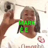 a woman is wearing a white shirt with the name mark ee on it