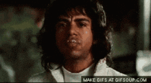 a close up of a man 's face with a make gifs at gifsoup.com watermark
