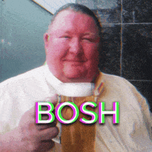 a man is holding a glass of beer and the word bosh is on the bottom
