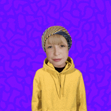a boy wearing a yellow hoodie stands in front of a speech bubble that says " hey "