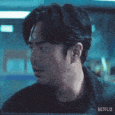 a close up of a man 's face with netflix written on the bottom