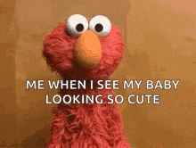 elmo from sesame street is looking at the camera and saying `` me when i see my baby looking so cute ''