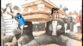 a video of a man carrying a coffin with a cartoon face on it