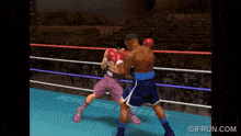 a video game screen shows two boxers in a ring and the website gifrun.com