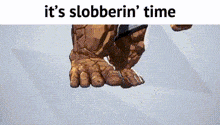 a cartoon of a man 's feet with the words `` it 's slobberin ' time '' written above them .