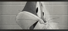 a black and white photo of bugs bunny taking a shower