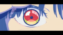 a close up of a woman 's eye with a rainbow colored pupil