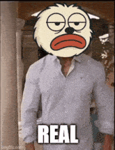 a man wearing a shirt with a cartoon character on his head and the words real on the bottom
