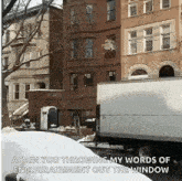 a white truck is parked in front of a building with the words again you throwing my words of encouragement out the window .
