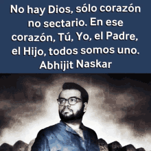 a man with glasses and a beard stands in front of a quote by abhijit naskar