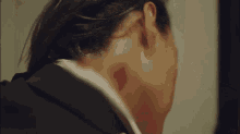 a close up of a man 's face with a lipstick mark on it .