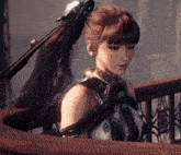 a woman with a ponytail and a sword behind her head