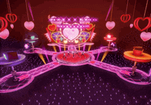 a group of people are dancing on a stage in front of a heart