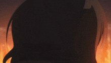 a close up of a person 's face with a fire behind them