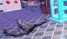 a person is laying on a checkered floor in a room .