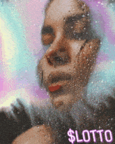 a woman 's face is behind a glass with drops of water and the word lotto on the bottom
