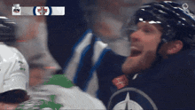 a hockey game is being shown on sn and a player is screaming