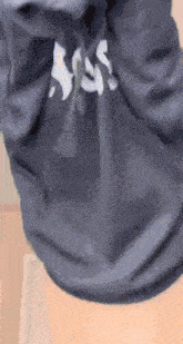 a close up of a person wearing a hoodie with the word sss on it .