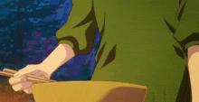 a person is holding chopsticks over a bowl of food