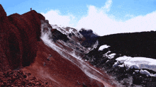 a person standing on top of a rocky mountain with the word orbo on the bottom