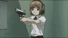 a girl wearing headphones is holding a gun with her eyes closed