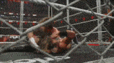 two wrestlers in a ring with the word raw written on the floor