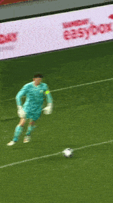a soccer player with the number 1 on his jersey is kicking a ball
