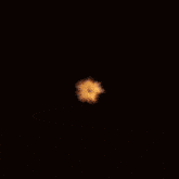 a close up of a fire explosion with a dark background