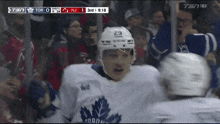 a hockey player with the number 29 on his helmet stands in front of a crowd