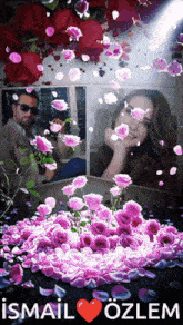 a picture of a man and a woman surrounded by pink roses with the name ismail ozlem