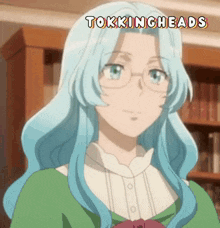 a woman with blue hair and glasses has the words tockingheads above her head