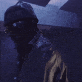 a person in a dark room with a lamp on