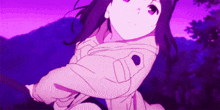a girl in a pink jacket is holding a purple object .