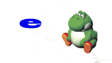 a green frog is sitting next to a blue cd
