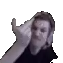 a man in a black shirt is making a funny face with his hand on his head .