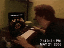 a person is looking at a computer screen that says five night at freddy 's on it