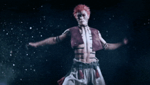 a man with red hair is jumping in the air in a dark room .