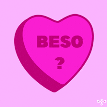 a pink heart with the words beso and a question mark