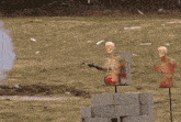 a man is shooting a gun at a target with a skeleton in the foreground