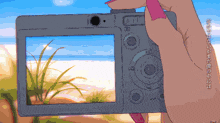 a pixel art drawing of a person taking a picture of the ocean