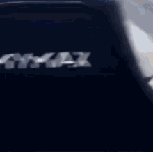 a close up of a car 's rear bumper with a blurry background .