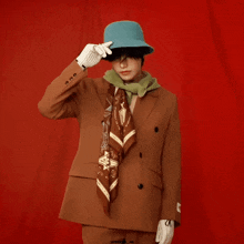 a man wearing a hat and a scarf has the word upbooks on the bottom