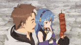 a man and a girl are looking at a skewer